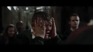 Man crying in dark room with people — Harry Potter and the Goblet of Fire