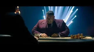man in purple suit at poker table — John Wick: Chapter 4