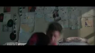 Spiderman in suit crouching on bed crying — The Amazing Spider Man 2