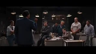 men in suits standing in office — The Wolf Of Wall Street