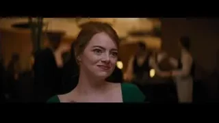Young woman with red hair in green dress — La La Land