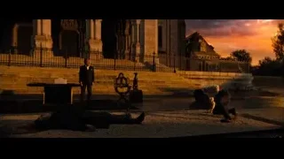 man lying outside church at sunset — John Wick: Chapter 4