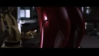 red robotic arm in workshop — Iron Man