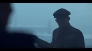 man in beret standing before cloudy sky — Peaky Blinders