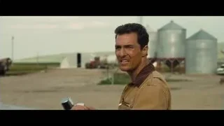 man in car holding metal object rural — Interstellar