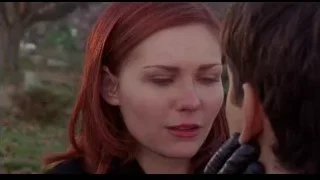woman with red hair and man outdoors — Spider Man