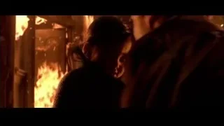 Young girl standing in front of raging fire — Spider Man 2