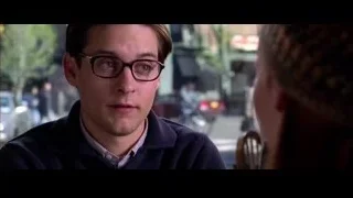 young man at restaurant table looking at woman — Spider Man 2