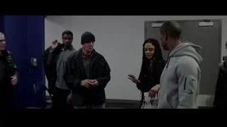 group of people in room with blue walls — Creed