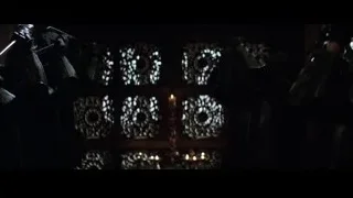 people holding torches in dark eerie setting — Batman
