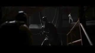 Man in black mask and cape with sword — Batman: The Dark Knight Rises