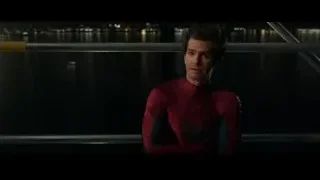 Spider-Man standing by city water at night — Spiderman: No Way Home