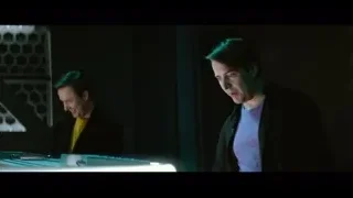 two men looking at futuristic screen — The Social Dilemma