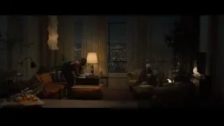 Man holding baby in living room at night — Creed 2