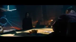 two men playing poker in dimly lit room — John Wick: Chapter 4