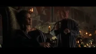 Man and woman by fireplace, man smoking — Gladiator