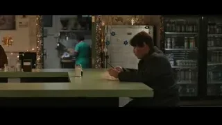 Woman writing at restaurant counter with menorah — Spiderman: No Way Home