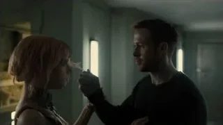 man and woman comforting in dark room — Blade Runner 2049