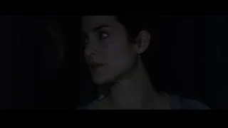woman with serious expression in dark — The Matrix