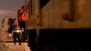 man inspecting old truck in desert — Breaking Bad