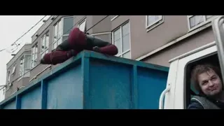 Deadpool standing by a car — Deadpool