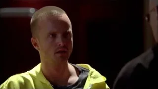 Man in yellow jacket in dimly lit room — Breaking Bad