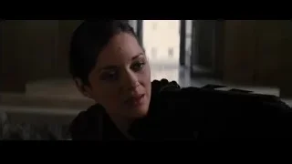 Woman's face in dimly lit room — Batman: The Dark Knight Rises