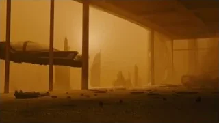 car in dimly lit garage with orange fog — Blade Runner 2049