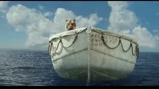 Tiger sitting on small white boat in ocean — Life of Pi