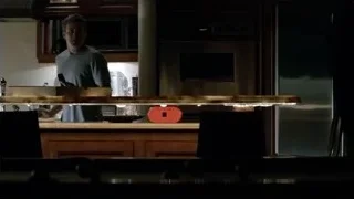 man working on laptop in kitchen — Suits