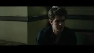 Young man deep in thought in dim room — The Social Network