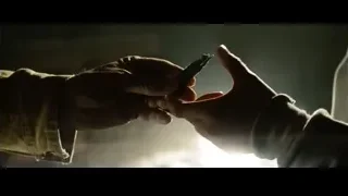 Hand holding lighter in dim room — Superman: Man of Steel