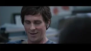 man wearing earphones serious expression — The Big Short