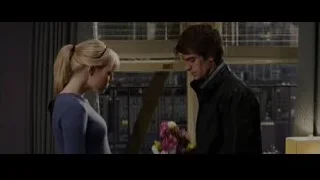 Man giving flowers to woman with city view — The Amazing Spider Man
