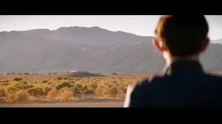 person looking at vast mountain landscape — Ford v Ferrari