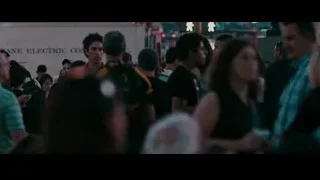 crowd in busy street with man in red shirt — The Dictator