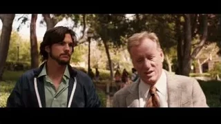 people walking in park with brick building — Jobs
