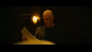 Bald man speaking passionately in dimly lit room — Whiplash