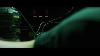 person wearing headphones in dark room — The Matrix