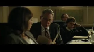three people in office, man deep in thought — The Social Network