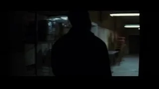 men in dimly lit warehouse — Batman: The Dark Knight Rises