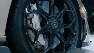 black car wheel with gold Lamborghini emblem — Sports Cars