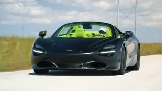 black McLaren 720S driving on track — Sports Cars