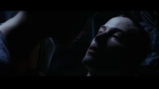 man's head resting on woman's shoulder — The Matrix