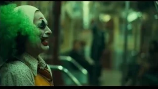 Joker in white clown mask and orange vest — Joker