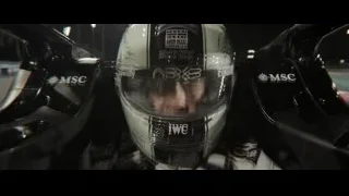 man in racing helmet in race car — F1