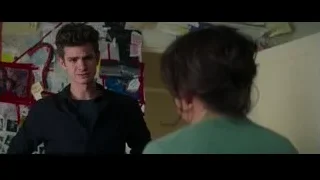 man and woman talking by bulletin board — The Amazing Spider Man 2