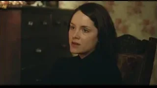 Young woman sitting in chair deep in thought — Peaky Blinders