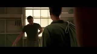 Two men in prison uniforms bending over bed — Hacksaw Ridge