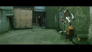 Man in distress in cluttered alleyway — The Matrix